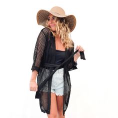 Slip into something classy this summer for all your beach plans with our new Coastal Views Crochet Tie Kimono! Lightweight yet still oh-so-cozy, this kimono is made with a soft crochet fabric and closes at the waist with a tie closure. And with the tie being removable, you can even style this kimono over your favorite dress or denim shorts! Available in white and black Measurements: Arms 9" / Length 35.5" / Width 17" + stretch Crochet Fabric, Favorite Dress, Denim Shorts, White And Black, Crochet, Fabric