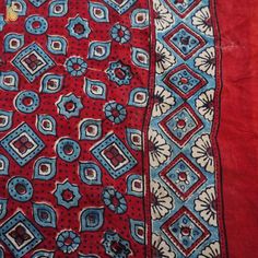 Fabric: Gajji Silk Weave – Bandhani with Ajrakh Pallu Color –Blue & Red Blouse – Ajrakh Note- There may be slight color variations due to photographic reasons. This is a hand-woven product and any irregularities in the weaving or pattern should not be taken as a defect. These irregularities make every handloom piece unique. Red Chanderi Kurta With Bandhani Print, Bohemian Traditional Wear With Batik Print For Festivals, Bohemian Batik Print Traditional Wear For Festivals, Red Bohemian Kurta For Diwali, Bohemian Mulmul Traditional Wear With Block Print, Traditional Batik Print Dupatta For Navratri, Transitional Bohemian Kurta With Bandhani Print, Bohemian Bandhani Print Saree For Transitional Season, Bohemian Bandhani Print Kurta For Transitional Season