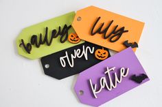 four tags with the words happy halloween written on them