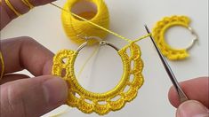 someone is crocheting the hoop around some yarn