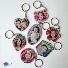 six different key chains with pictures of people in the shape of hearts and flowers on them