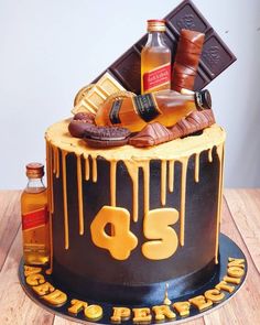 a birthday cake decorated with chocolate and liquor