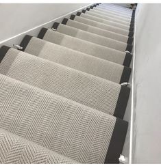 a set of stairs with carpeted treads