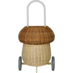 a wicker baby stroller with wheels and handlebars on the front, against a white background