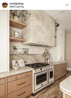 an image of a kitchen setting with marble counter tops and wood cabinetry on the wall