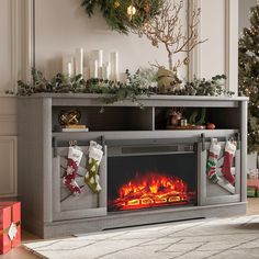 a christmas fireplace with stockings hanging from it