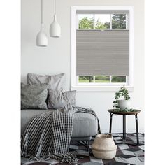 a living room scene with focus on the window and blinds in the windowshade