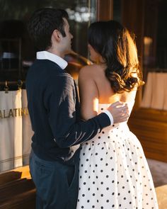 Couple embracing in elegant outfits, woman wearing polka dot dress and man in dark sweater during engagement photoshoot Sophisticated Couple, Engagement Outfit Ideas, Engagement Look, Dress Engagement, Couple Fashion, Couple Style, Engagement Outfit, Engagement Outfits, Fashion Couple