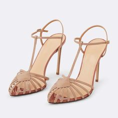 Elevate your style with these apricot t-strap slingback stiletto heeled sandals. Featuring a sleek cage strappy design, these sandals add flair to any outfit, blending sophistication and trendiness effortlessly. Color: Nude Material: Patent leather Heel Type: Stiletto heel Heel height: 4.72" / 120 mm approx Product measurements were taken using size 8. Please note that measurements may vary by size. Toe: Pointed toe Adjustable buckle strap design Handcrafted US sizing. Fits true to size. Chic 4-inch T-strap Heels, Spring Ankle Strap Heels With Multiple Straps, Chic T-strap Heels With Heel Strap, Spring Strappy Slingback Pumps With 4-inch Heel, Strappy Slingback Pumps With 4-inch Heel For Spring, Chic High Heel T-strap Sandals, Summer T-strap Heels With 4-inch Heel, Elegant Sandals With Multiple Ankle Straps, Chic High Heel With Multiple Straps