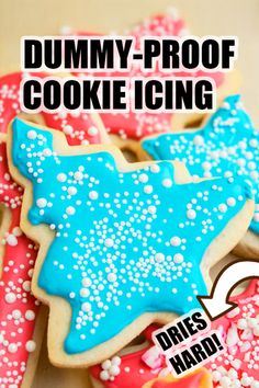 some cookies that are decorated with icing and sprinkles