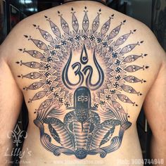 a man with a tattoo on his back