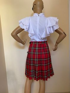 "This beautiful tartan skirt is made from fine soft viscose fabric. Knee lenght 55 cm. Wrap front and pleated full back. SIZE CHART SIZE S - US 6, UK 8, EU 36 bust: bust around 34.5\"/90cm Waist: waist around 27.5\"/70cm Hips: hips around 34.5\"/90cm SIZE M - US 8, UK 10, EU 38 bust: bust around 37.5\"/95cm Waist: waist around 29.5\"/75cm Hips: hips around 37.5\"/95cm SIZE L - US 10, UK 12, EU 40 bust: bust around 39.5\"/100cm Waist: waist around 31.5\"/80cm Hips: hips around 39.5\"/100cm SIZE X Fitted Pleated Midi Skort, Scottish Style Fitted Pleated Skirt For Fall, Fitted Pleated Mini Skirt With Ruffles, Fitted Full Skirt In Plaid, Fitted Accordion Pleats Pleated Skirt For School, Preppy Pleated Flared Skirt, Preppy Fitted Skirt With Pleated Hem, Fitted School Uniform Pleated Skirt With Accordion Pleats, Preppy Fitted Pleated Skirt