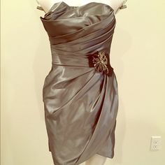 Nwot Never Worn. Built In Bra For Comfort And Stability. Beautiful Gunmetal Grey Color Metallic Silver Sleeveless Elegant Mini Dress, Elegant Silver Mini Dress For Cocktail, Elegant Silver Strapless Mini Dress, Elegant Metallic Silver Mini Dress For Spring, Glamorous Silver Satin Mini Dress, Silver Satin Mini Dress For Night Out, Silver Satin Cocktail Dress, Elegant Silver Satin Mini Dress, Elegant Gray Mini Dress For Formal Occasion