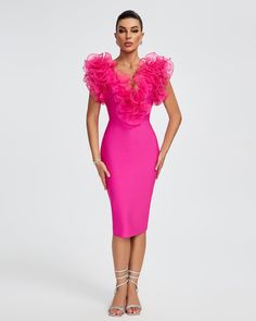 a woman in a bright pink dress