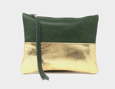 Toiletry bag leather, small leather pouch, leather gold, leather purse, cosmetic bag leather Small cosmetic pouch in two colors, gold and green leather. You can use it also as a clutch or a jewelry bag. Elegant and simple multitask for every day. Suitable as a cosmetic bag, purse, pencil case or evening clutch. - H x W x D (cm): 16 x 20 - Metal zipper - double-sided signature stamping Small Leather Pouch, Gold Cosmetic, Leather Hip Bag, Small Leather Bag, Gold Clutch, Black Leather Tote Bag, Bag Elegant, Leather Belt Bag, Gold And Green