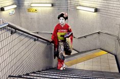 a person with a mask walking up some stairs