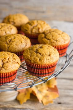 muffins cooling on a wire rack with autumn leaves in the backgroud