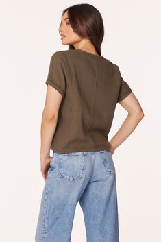 Upgrade from a classic tee with this cotton-gauze v-neck top in a boxy, cropped silhouette. In our signature beach gauze, this army green top travels well, combining both comfort and elevated-casual style. *100% Cotton *Body Length: 20" *Beach Gauze *Model is 5’8 1/2” and wearing size SMALL 53E-72294 Summer Cotton Cropped V-neck T-shirt, Relaxed Cotton V-neck Top, Casual V-neck Cropped T-shirt For Summer, Versatile Cotton V-neck Tops, Casual Everyday Cotton V-neck Top, Summer V-neck Cropped T-shirt, Trendy Cotton Cropped T-shirt V-neck, Trendy Cotton V-neck Cropped T-shirt, Casual Boxy Top For Summer