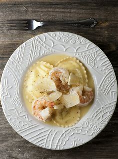 Shrimp scampi meets ravioli in this elegant and easy recipe - a match made in heaven! #seafood #shrimp #ravioli #pasta #framedcooks #nomnom #foodie