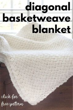 a white crocheted blanket sitting on top of a wooden dresser next to a window