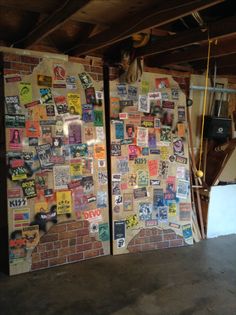 two refrigerators covered in stickers and magnets next to each other on a brick wall