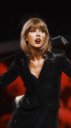 taylor swift performing on stage at the brity awards in london, england during her performance