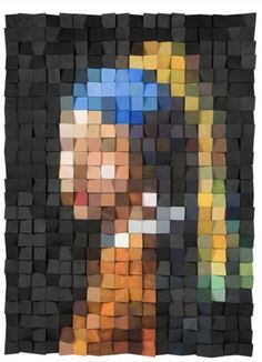 a piece of art that looks like a woman's face is made out of squares