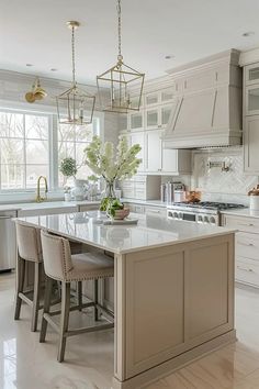 a large kitchen with white cabinets and marble counter tops, along with two bar stools