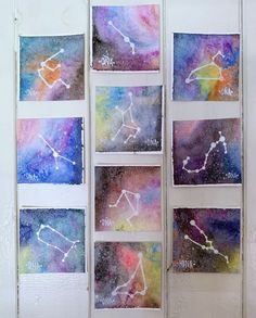 four different pictures of the zodiac signs in watercolor and ink on white paper, hanging on a wall