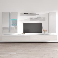 a white living room with glass shelves and a flat screen tv mounted on the wall