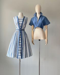 two mannequins dressed in blue and white dresses