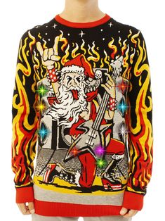 a man wearing a christmas sweater with an image of santa on it