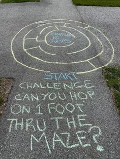 chalk writing on the pavement in front of a building that reads start challenge can you use only foot through the maze?