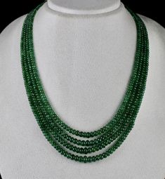 PRODUCT DETAILS LINE 4 /CTS 334 EMERALD ROUND BEADS NECKLACE ALL NATURAL UNHEATED UNTREATED EMERALD NO RESIN MINOR OIL CERTIFIED BY GTL LAB SIZES OF THE BEADS ARE FROM 8 MM TO 3.5 MM NECK LENGTH OF THE NECKLACE IS 17 INCHES OUTER LENGTH OF THE NECKLACE IS 19 INCHES ATTACHED TO SIZABLE SILK CORD BEST EMERALD GREEN COLOUR FINE LUSTRE PERFECT ROUND SHAPE BUY IT NOW NOTE - #You will receive the same product you see in picture. #DEAR ETSY BUYERS PLEASE FEEL FREE TO ASK QUESTIONS #WE WILL BE GLAD TO A Emerald Green Colour, Round Bead Necklace, Emerald Bead, Zambian Emerald, Silk Cord, Bead Stringing, Green Colour, Multi Strand Necklace, Natural Red