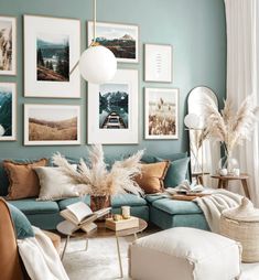 a living room filled with furniture and pictures on the wall above it's coffee table