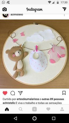 a teddy bear and bib hanging on a string