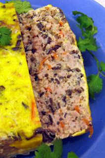 two pieces of food on a blue plate with parsley sprinkled around it