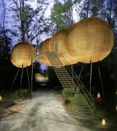 an artistic display in the middle of a path with lights on it and stairs leading up to them