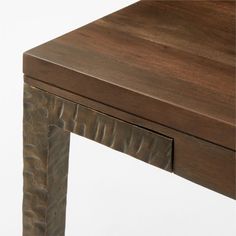 a close up of a wooden table with two drawers on each side and one drawer at the top