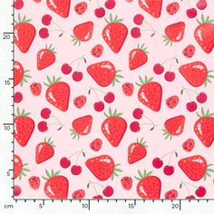 a pink background with red strawberries and cherries on it, as well as a ruler