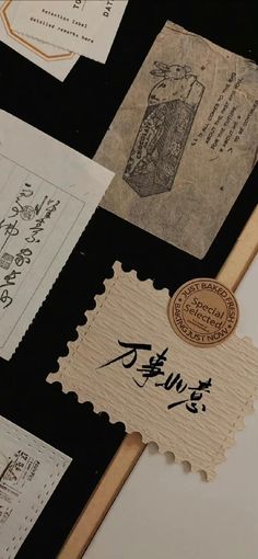 an assortment of stamps and envelopes with writing on them