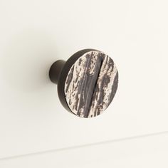 a door knob with a black and white design on it