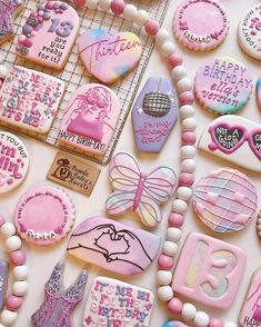 some decorated cookies are laying on a table