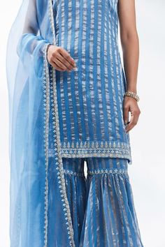 Cerulean blue kurta with stripe woven motifs and gota patti, zari, aari, zardozi embroidery on neckline. Paired with tiered gharara and dupatta. - Aza Fashions Blue Kurta, Zardozi Embroidery, Women Kurta, Cerulean Blue, Straight Kurta, Set Women, Aza Fashion, Embroidery, Blue