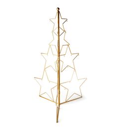 a gold metal christmas tree with white stars on the top and bottom, standing upright against a white background