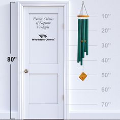 the measurements of a door with a wind chime hanging from it's side