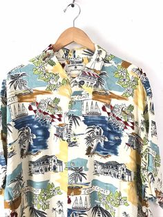 "-Description- >colorful island resort print men's hawaiian shirt >button front >collared >button close pocket on the front >mens XL >awesome print! >condition: great >color(s): multi >fabric(s): 100 rayon >brand: preswick & moore >care: machine wash -Measurements- >size: XL ✩ all measurements are taken with the item laying flat & some sizes are estimates so please check measurements ✩ chest: 50\" / 127cm length: 31\" / 78cm shoulder to sleeve end: 11\ Beach Multicolor Print Collared Shirt, Multicolor Print Collared Beach Shirt, Collared Hawaiian Shirt With Graphic Print For Vacation, Multicolor Collared Hawaiian Shirt For Vacation, Multicolor Collared Hawaiian Shirt For Beach Season, Multicolor Palm Tree Print Camp Shirt For Beach Season, Patterned Camp Collar Beach Shirt, Multicolor Floral Print Camp Shirt For Beach Season, Patterned Camp Shirt With Camp Collar For Beach