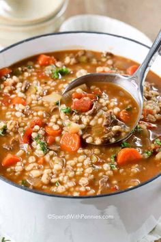 a white bowl filled with soup and vegetables