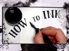 someone is writing how to ink on a piece of paper with black ink and a pen