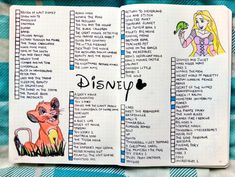 an open notebook with disney characters on it